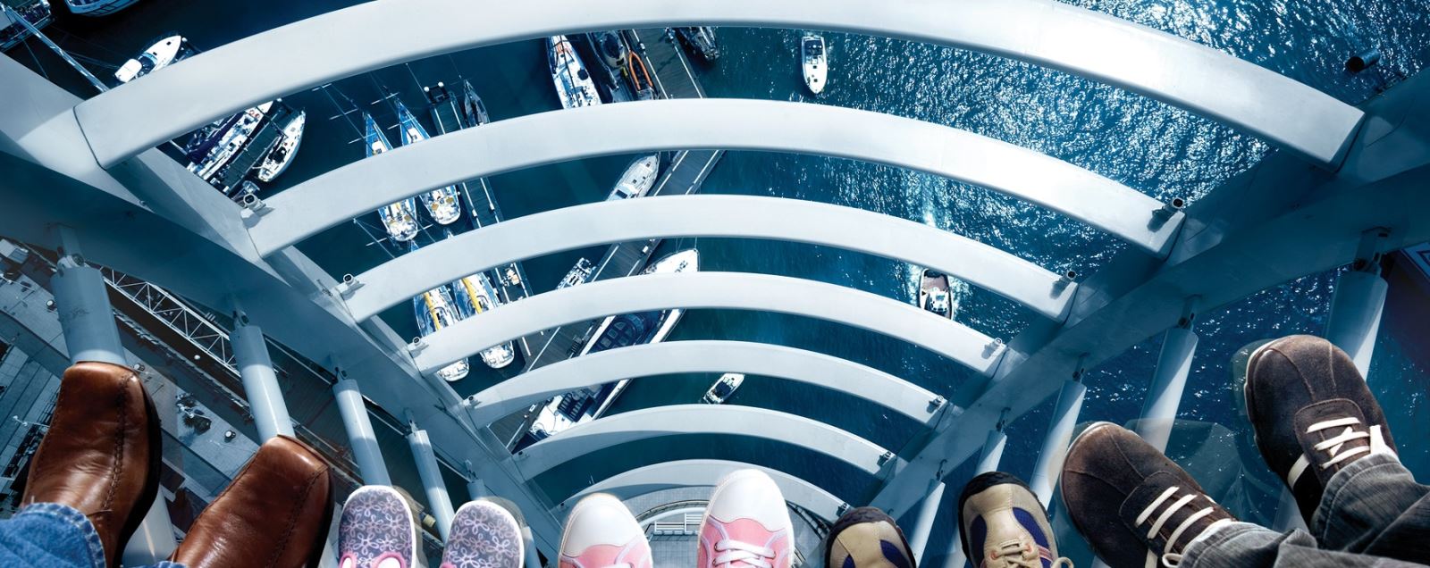 Family looking through the glass floor at Spinnaker Tower
